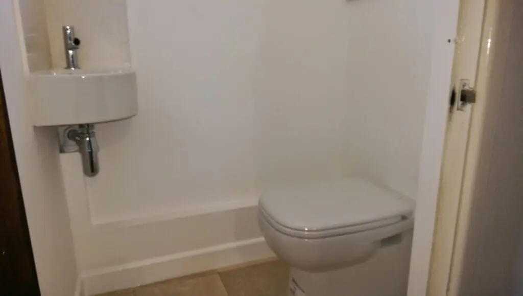 Toilet and Corner Sink Installed