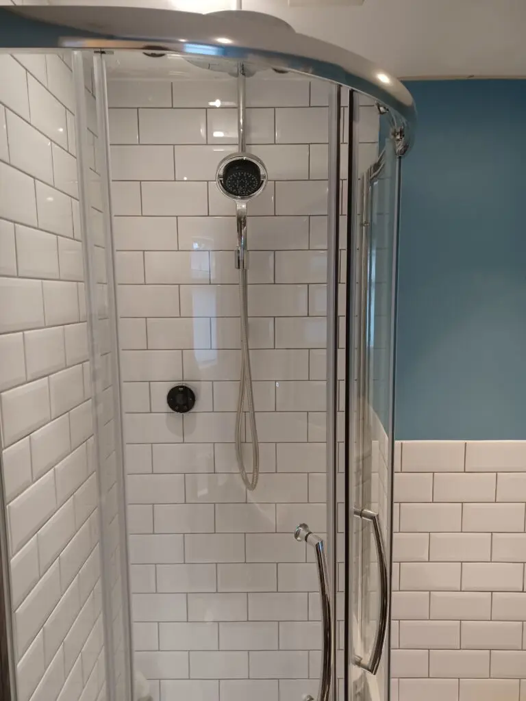 Metro white tiles and Mira shower