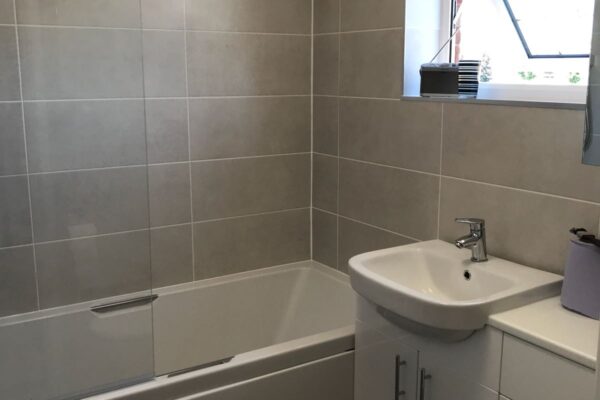 new bathroom fitted, rounded shower glass