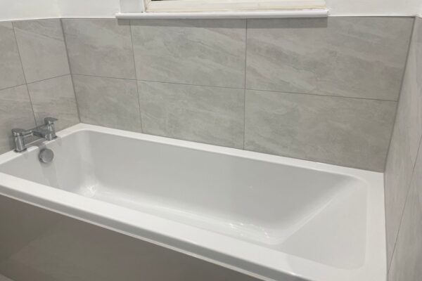 Eastbrook bath with grey tiles